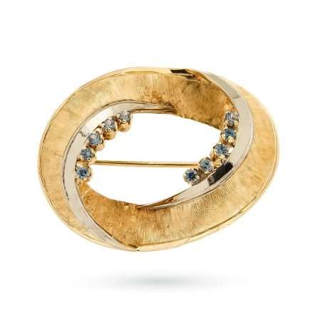 Oval brooch in 18kt yellow gold with blue sapphires