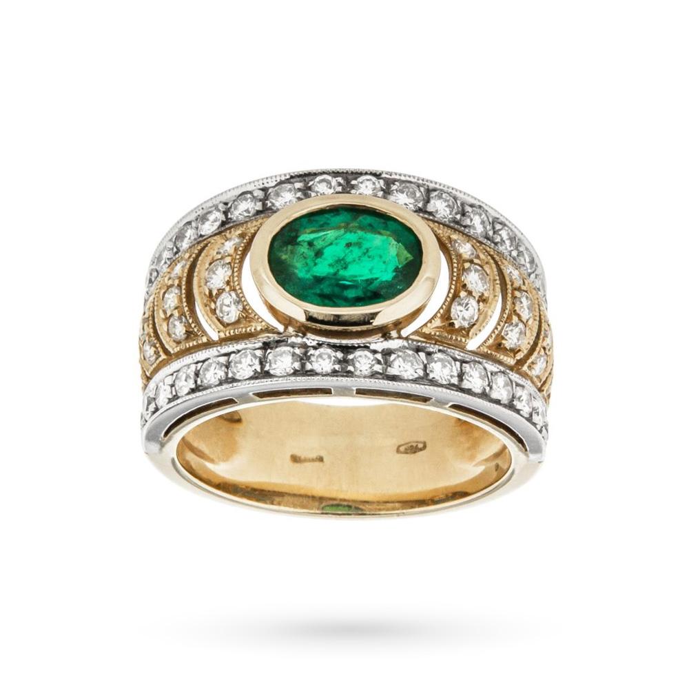 Anillo ovalado de oro amarillo con esmeralda de 1,04ct y diamantes de 0,91ct