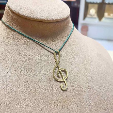 Colgante Clave de Sol en oro amarillo de 18 kt