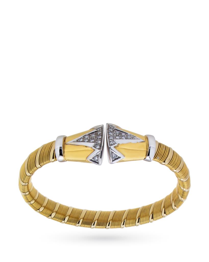 Pulsera rígida en oro amarillo y blanco con diamantes.
