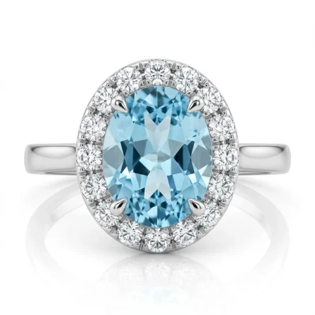 Anillo con halo en oro blanco con aguamarina ovalada (1,15 ct) y diamante envolvente (0,145 ct)