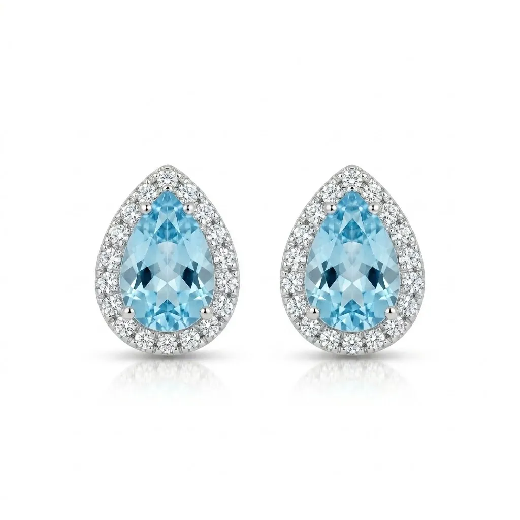 Orecchini a lobo in oro bianco con acquamarine a goccia (1.29 ct) e diamanti (0.21 ct). Design raffinato e luminoso in 2,69 g. Acquista l'eccellenza orafa.