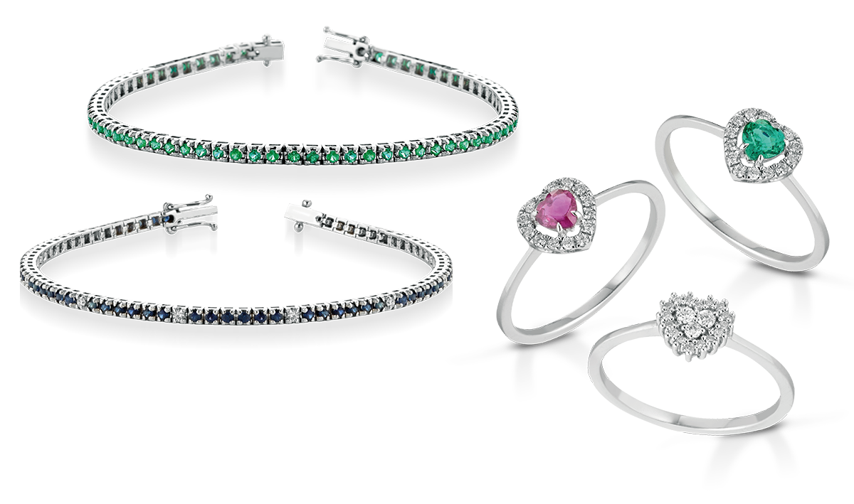 Due bracciali tennis con pietre verdi e blu e tre anelli con smeraldo, rubino e diamanti