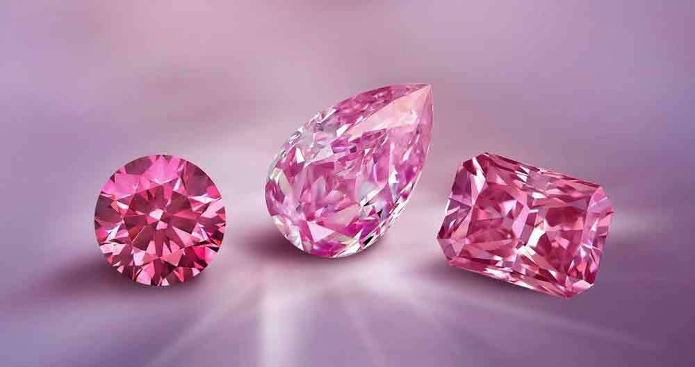 Three faceted pink gems: round, pear and rectangular cut